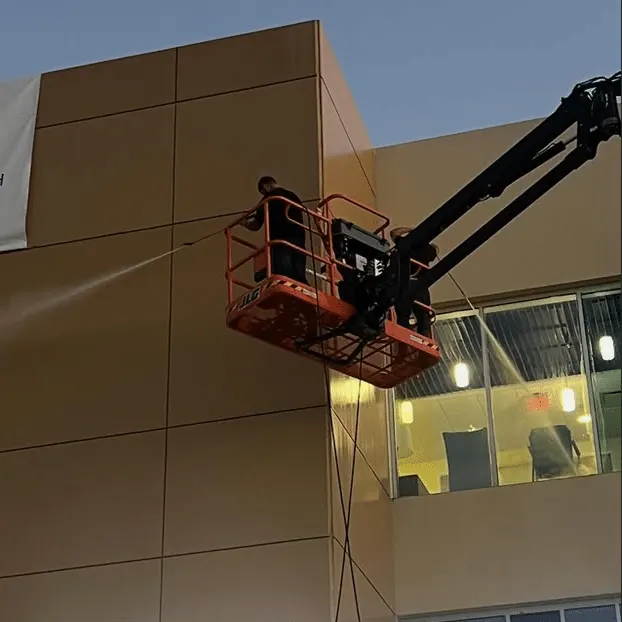 Commercial pressure washing Sacramento — Pro Wash crew on boom lift